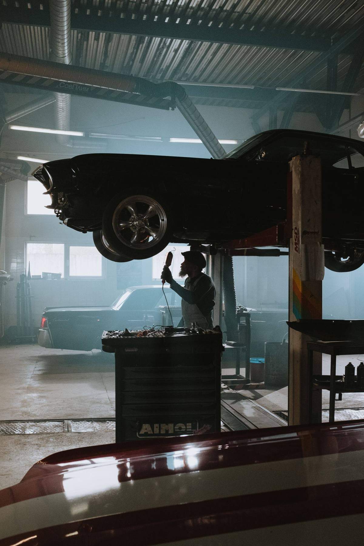 Car raised on a lift in the Heartland Auto Group shop